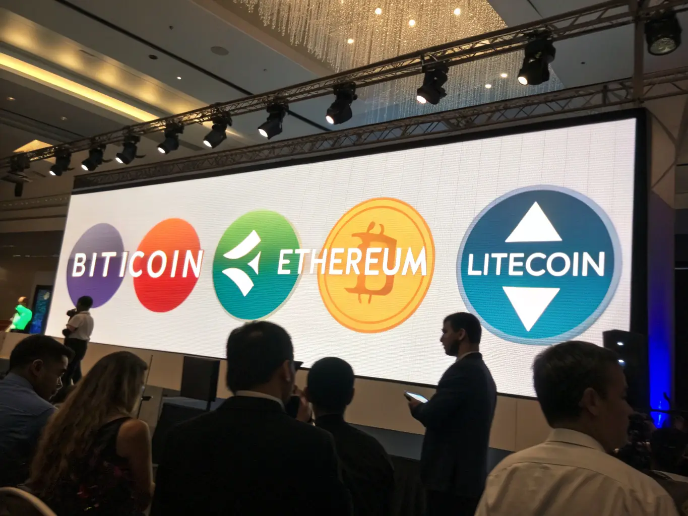 A digital rendering of various cryptocurrencies overlaid on a world map, representing the global reach and potential of cryptocurrency investments.